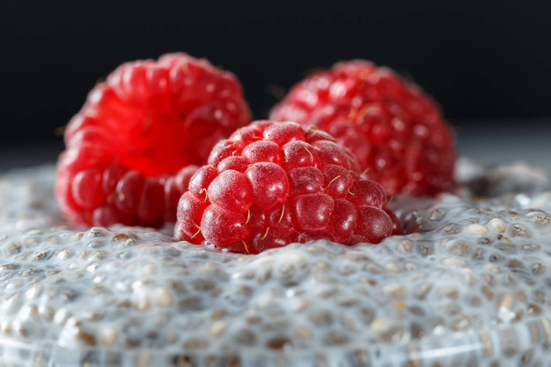Macro shot of chia seed pudding with raspberries - Foto, immagini