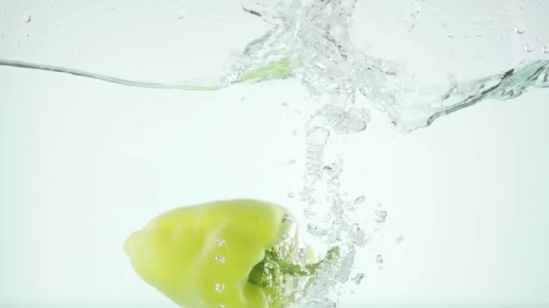 Bell pepper falls in water - Video, Çekim