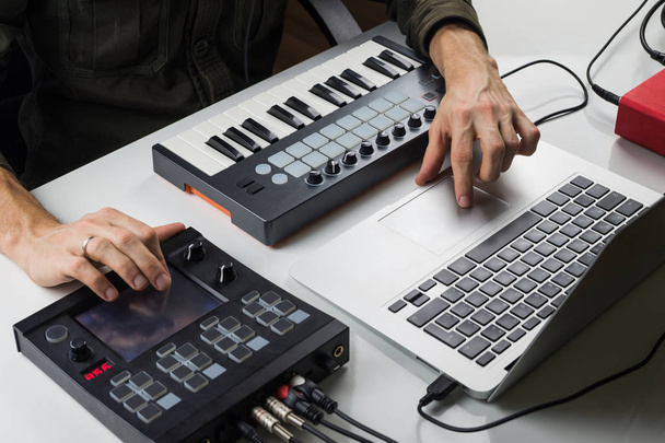 Producing electronic music on laptop with portable midi keyboard and electronic effect processors - Photo, image