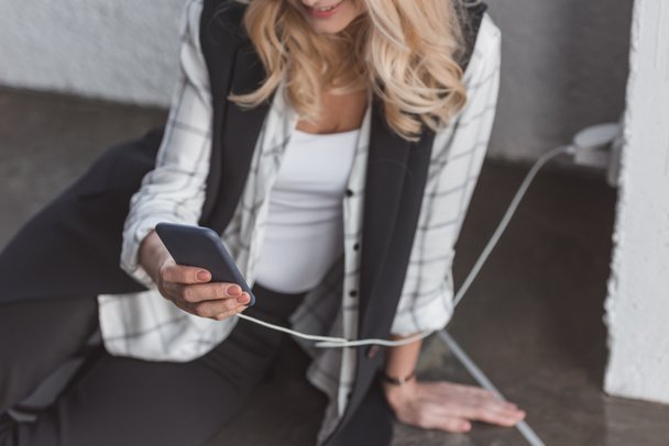 businesswoman charging phone - Photo, Image