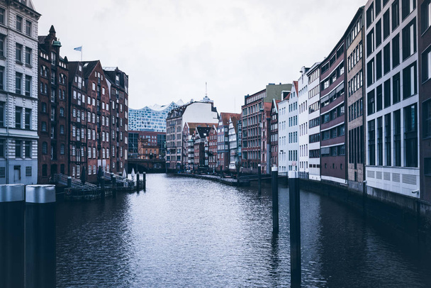 historic warehouses at Nikolaifleet canal in Hamburg, Germany - Photo, Image