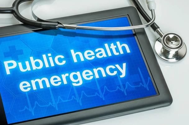 Tablet z tekstem zagrożenia zdrowia publicznego na wyświetlaczu  - Zdjęcie, obraz