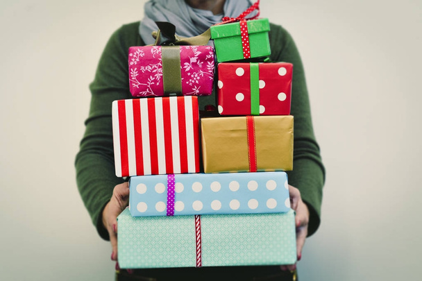 young woman with a pile of gifts - Foto, imagen