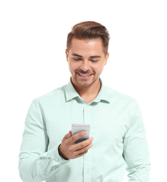 Young handsome man with mobile phone - Фото, изображение