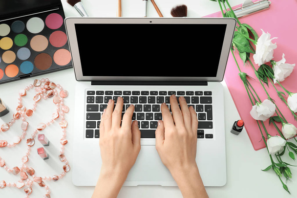 Hands of beauty blogger with modern laptop  - Photo, Image