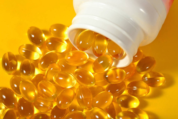 Omega-3 fish fat oil capsules in a bottle - Photo, Image