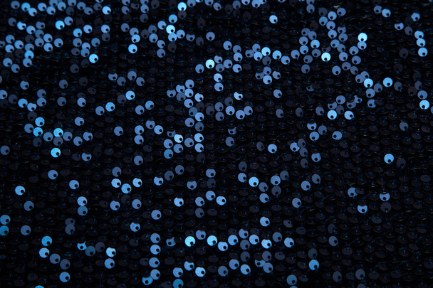 прямокутна темно-синя блискуча тканина з блискітками
 - Фото, зображення