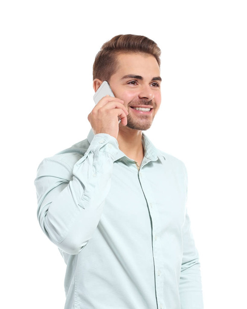Young handsome man talking on his mobile phone - Foto, afbeelding