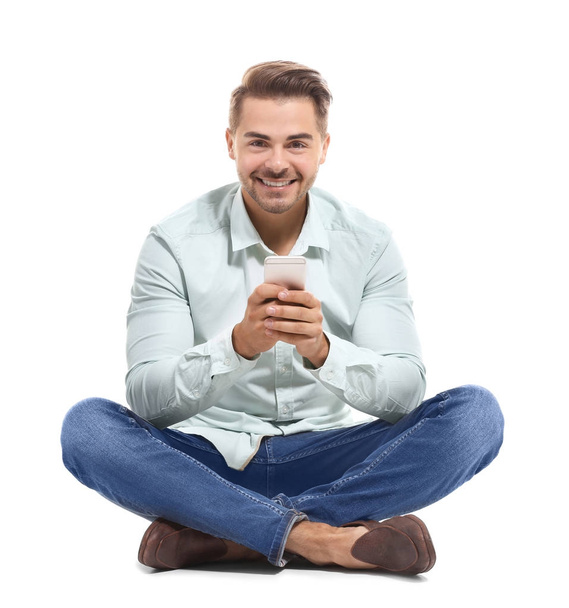 Young handsome man with mobile phone - Foto, afbeelding
