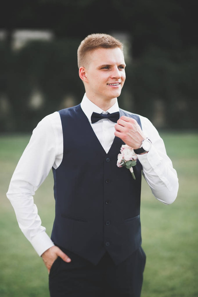 Headshot portrait of young man smiling isolated on outside outdoors background - Photo, Image