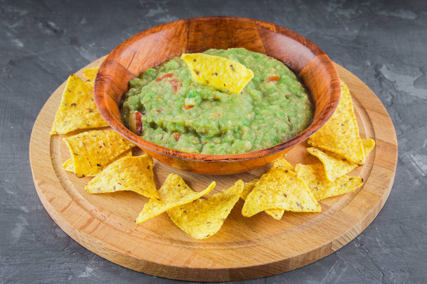 nachos with guacamole on a gray background - Фото, зображення