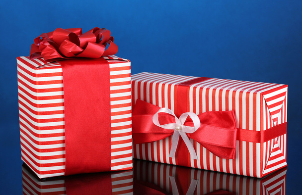 Colorful red gifts on blue background - Photo, image