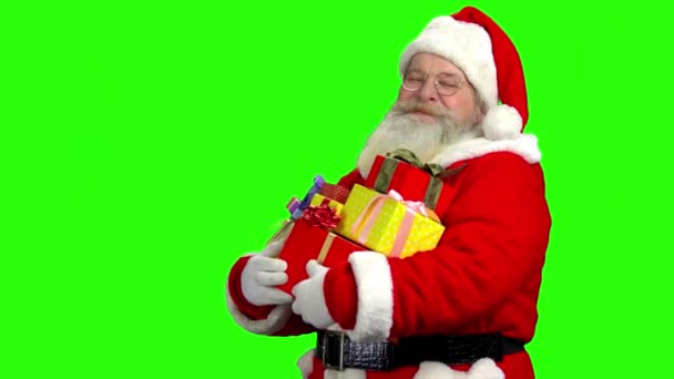 Weihnachtsmann mit Geschenken, chromakey Hintergrund. - Filmmaterial, Video