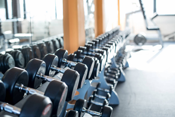 Row of dumbbells in gym - Photo, image