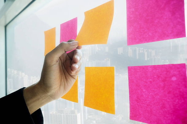 Note paper reminder schedule board. Business people meeting and use post it notes to share idea. Discussing - business teamwork brainstorming concept. - Photo, Image