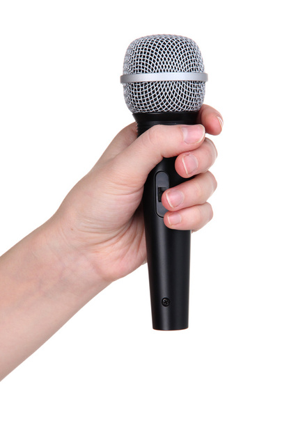 Black microphone in hand isolated on white - Photo, image