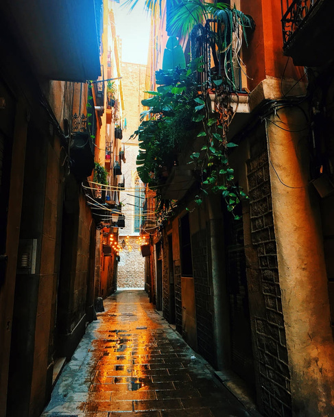 view looking down a narrow street in the Gothic Quarter, Old Town, of Barcelona, Spain - Zdjęcie, obraz