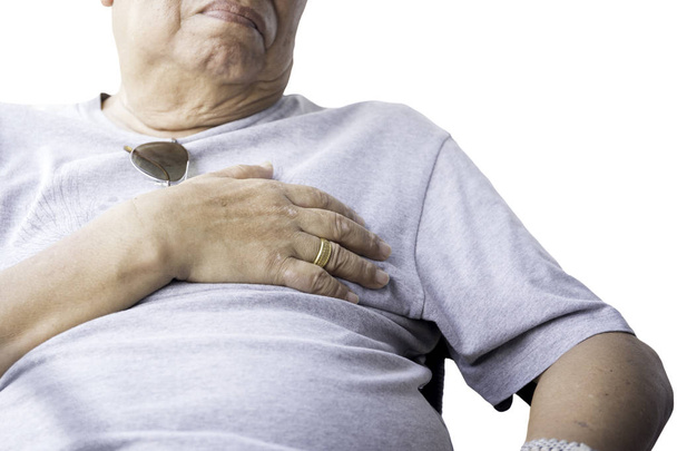 Senior man overweight hand grabbing his chest isolated - Zdjęcie, obraz