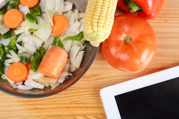 Vegetables and seasonings with a digital tablet. - Photo, image