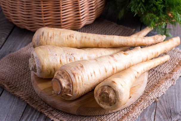 Parsnips on a wooden cutting board - Photo, Image