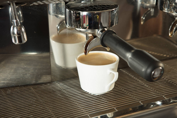 Close-up of espresso pouring from coffee machine  - Photo, Image
