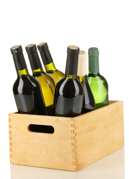 Wine bottles in wooden box isolated on white - Фото, изображение