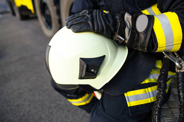 Rescue firefighter in safe helmet  - Fotoğraf, Görsel