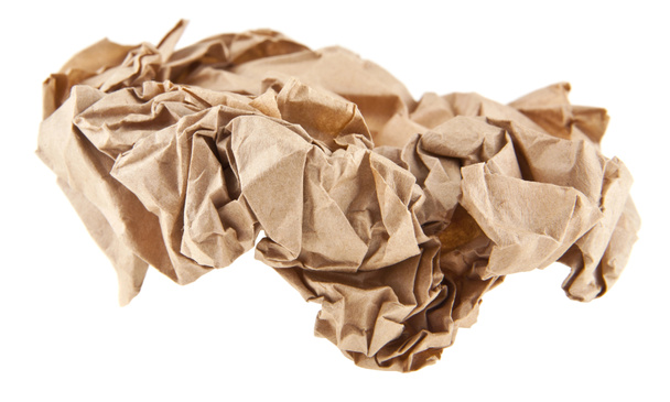 коричневая морщинистая бумага на белом фоне крупным планом
 - Фото, изображение