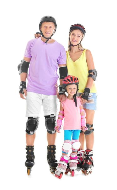 Family on roller skates against white background - Foto, afbeelding