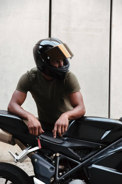 Portrait of a modern young afro american man in helmet - Photo, Image