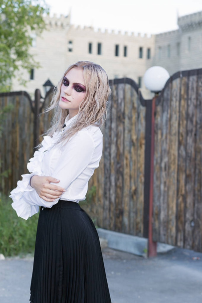 A fashion gothic style portrait of a beautiful blonde girl - Фото, зображення