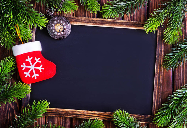 Chalkboard with Christmas decoration - Фото, зображення