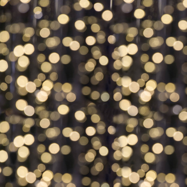 Blurred garland. City light blur bokeh, defocused background. Christmas abstract. - Φωτογραφία, εικόνα