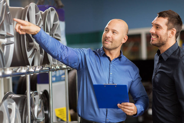 customer and salesman at car service or auto store - Photo, Image