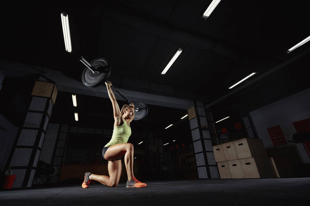 Female crossfit athlete exercising - Photo, image
