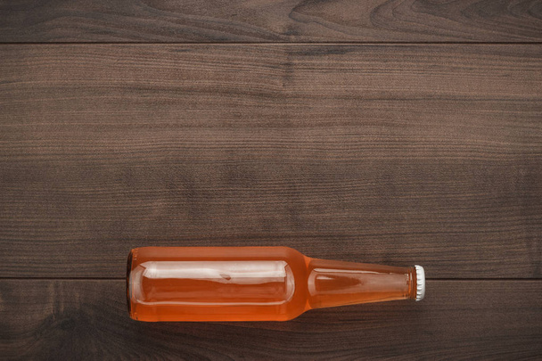 glass bottle of orange sweet drink - 写真・画像