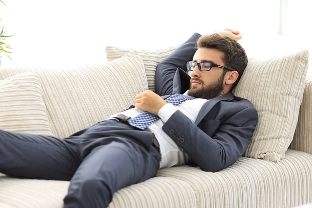 tired businesswoman relaxing on the couch. - Φωτογραφία, εικόνα
