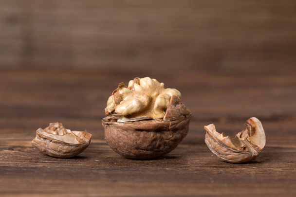 Almonds, walnuts and hazelnuts on wooden table / assortment of nuts - Zdjęcie, obraz