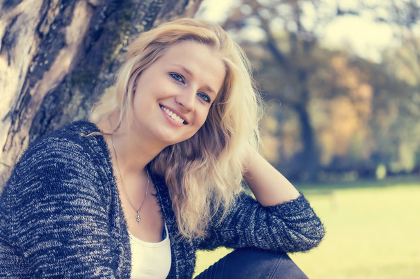 Portrait of smiling young woman  - Fotó, kép