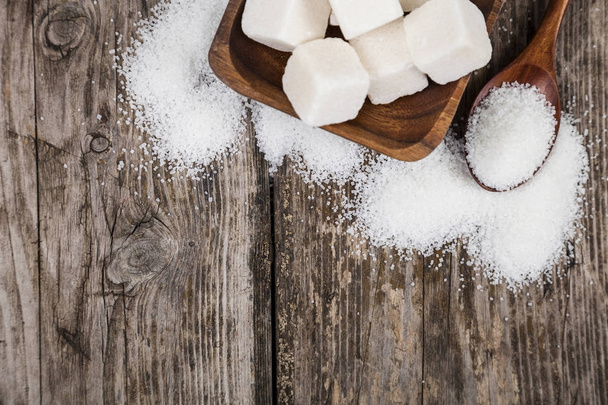 Sugar in a wooden bowl and a spoon   - Photo, Image