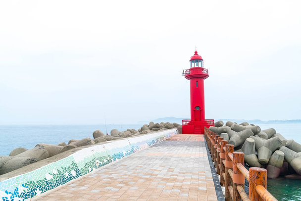 red lighthouse in Jeju Island - 写真・画像