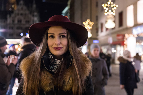 Woman with hat portrait in Munich during Christmas time - Foto, immagini