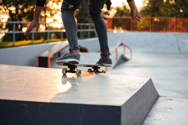 Cropped image of a skater boy practicing - Zdjęcie, obraz