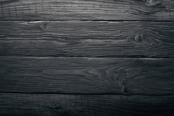 Black wooden background. Texture. Top view. Free space. - Foto, afbeelding