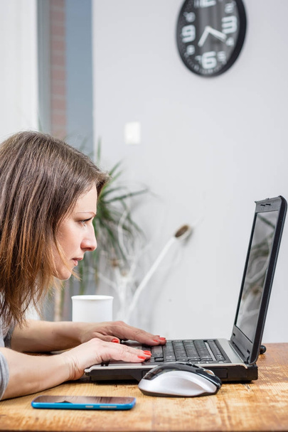 Photo of young business woman looking at the laptop - Foto, Bild