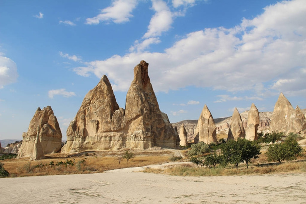 Natural valley with volcanic tuff stone rocks in Goreme in Cappadocia, Turkey. - Fotó, kép