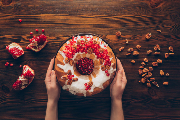 hands with christmas cake - Photo, Image