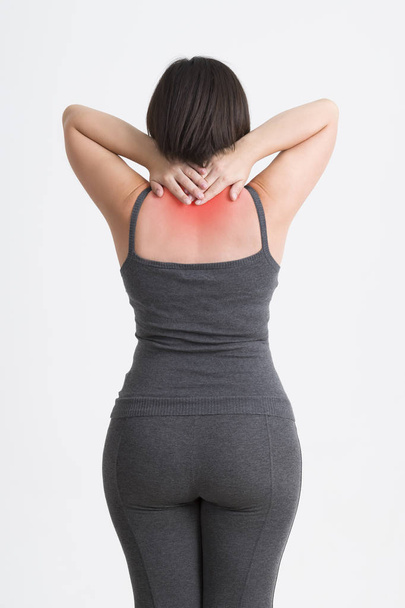 Neck pain, woman with backache on gray background - Fotoğraf, Görsel