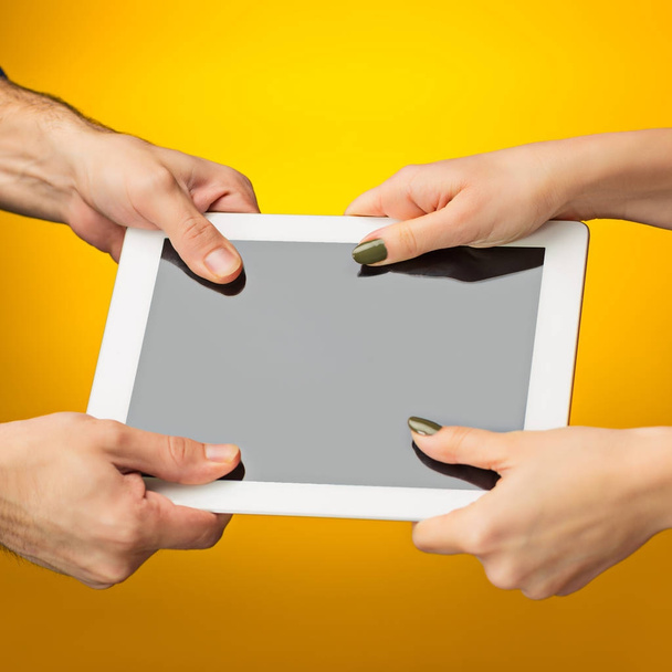 female teen hands using tablet pc with black screen, isolated - Foto, afbeelding