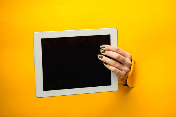 female teen hands using tablet pc with black screen, isolated - Фото, зображення